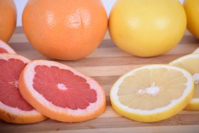 A picture of citrus fruits, including grapefruit and lemon